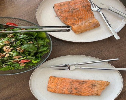 Healthy green salad and fresh vegetables on a table